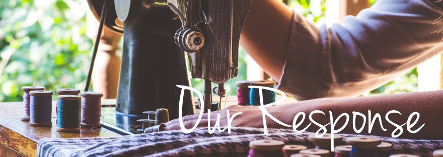 Young girl sews on the old sewing machine